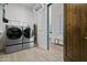 Laundry room with washer, dryer, and extra shelving at 7450 E Continental Mountain Dr # 5, Cave Creek, AZ 85331