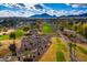 Aerial view of community and golf course with mountain backdrop at 7500 E Mccormick Pkwy # 32, Scottsdale, AZ 85258