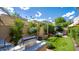 Private backyard with artificial turf, a pergola, and a built-in grill at 7500 E Mccormick Pkwy # 32, Scottsdale, AZ 85258