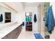 Contemporary bathroom with dual sinks, walk-in shower, and views to bedroom at 7500 E Mccormick Pkwy # 32, Scottsdale, AZ 85258