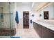 Modern bathroom boasts dual sinks, a large shower, and ample storage at 7500 E Mccormick Pkwy # 32, Scottsdale, AZ 85258