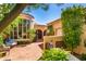 Private courtyard with seating area and Mediterranean-style architecture at 7500 E Mccormick Pkwy # 32, Scottsdale, AZ 85258