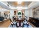 Formal dining room with chandelier and view of kitchen and living room at 7500 E Mccormick Pkwy # 32, Scottsdale, AZ 85258