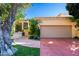 Charming single-story home with a terracotta driveway and mature trees at 7500 E Mccormick Pkwy # 32, Scottsdale, AZ 85258