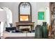 Living room fireplace with ornate mantel and large mirror above at 7500 E Mccormick Pkwy # 32, Scottsdale, AZ 85258