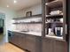 Modern kitchen with light wood flooring and stainless steel appliances at 7500 E Mccormick Pkwy # 32, Scottsdale, AZ 85258