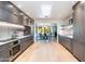 Open concept kitchen with stainless steel appliances and views into dining area at 7500 E Mccormick Pkwy # 32, Scottsdale, AZ 85258