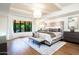 Luxurious main bedroom with a large bed, plenty of natural light, and a curved window at 7500 E Mccormick Pkwy # 32, Scottsdale, AZ 85258