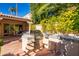Stainless steel outdoor kitchen with built-in grill and side burners at 7500 E Mccormick Pkwy # 32, Scottsdale, AZ 85258