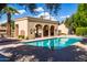 Community pool with a covered patio and comfortable lounge chairs at 7500 E Mccormick Pkwy # 32, Scottsdale, AZ 85258