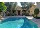 Inviting community pool with surrounding landscaping and lounge chairs at 7500 E Mccormick Pkwy # 32, Scottsdale, AZ 85258