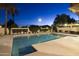 Community pool at night with surrounding landscaping at 7500 E Mccormick Pkwy # 32, Scottsdale, AZ 85258