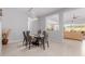 Elegant dining room with a glass table and modern chairs at 7520 E Peralta Ave, Mesa, AZ 85212