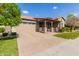 Single-story home with a covered porch and landscaped yard at 7520 E Peralta Ave, Mesa, AZ 85212