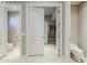View of a toilet and access to another bathroom area at 8037 E Thorntree Dr, Scottsdale, AZ 85266