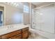 Clean bathroom with a shower/tub combo and wood vanity at 8037 E Thorntree Dr, Scottsdale, AZ 85266