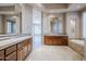 Luxurious bathroom with and vanities and soaking tub at 8037 E Thorntree Dr, Scottsdale, AZ 85266