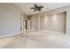 Bright bedroom with ceiling fan and access to bathroom at 8037 E Thorntree Dr, Scottsdale, AZ 85266