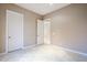 Simple bedroom with neutral walls and tile floors at 8037 E Thorntree Dr, Scottsdale, AZ 85266