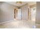 Bedroom with multiple doors and tile floors at 8037 E Thorntree Dr, Scottsdale, AZ 85266