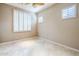 Bedroom with ceiling fan, plantation shutters, and tile floor at 8037 E Thorntree Dr, Scottsdale, AZ 85266