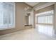 Spacious dining room featuring tile floors and plantation shutters at 8037 E Thorntree Dr, Scottsdale, AZ 85266