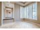 Sunlit dining room with tile floors and plantation shutters at 8037 E Thorntree Dr, Scottsdale, AZ 85266