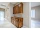 Hallway with built-in wooden cabinets and storage at 8037 E Thorntree Dr, Scottsdale, AZ 85266
