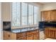 Kitchen with granite countertops and stainless steel dishwasher at 8037 E Thorntree Dr, Scottsdale, AZ 85266