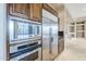 Modern kitchen with stainless steel appliances and built-in microwave at 8037 E Thorntree Dr, Scottsdale, AZ 85266
