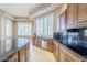 Kitchen features a large island, stainless steel appliances, and a view at 8037 E Thorntree Dr, Scottsdale, AZ 85266