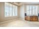 Kitchen area with wood cabinets and large windows at 8037 E Thorntree Dr, Scottsdale, AZ 85266