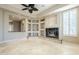Living room with fireplace and built-in shelving at 8037 E Thorntree Dr, Scottsdale, AZ 85266
