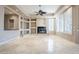 Living room with fireplace and built-in shelving at 8037 E Thorntree Dr, Scottsdale, AZ 85266