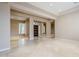 Spacious living room with tile floors and lots of natural light at 8037 E Thorntree Dr, Scottsdale, AZ 85266