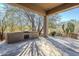 Covered patio with built-in grill and flagstone at 8037 E Thorntree Dr, Scottsdale, AZ 85266