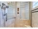 Spa-like shower with glass block accents and built-in seat at 8037 E Thorntree Dr, Scottsdale, AZ 85266