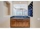 Wet bar with dark countertop and wine storage at 8037 E Thorntree Dr, Scottsdale, AZ 85266