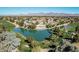 An aerial shot of a community near a lake and golf course with mountain views at 8208 E Shea Blvd, Scottsdale, AZ 85260