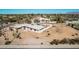 Aerial view showcasing a mid-century modern home with surrounding desert landscape at 8208 E Shea Blvd, Scottsdale, AZ 85260