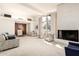 Spacious living room with fireplace and large windows at 8208 E Shea Blvd, Scottsdale, AZ 85260