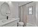 Clean bathroom with white subway tiles, a bathtub, and modern vanity at 827 W Weldon Ave, Phoenix, AZ 85013