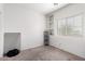 Small bedroom with a window and built-in shelves at 9331 S 33Rd Gln, Laveen, AZ 85339