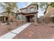 Two-story house with a front porch and walkway at 9331 S 33Rd Gln, Laveen, AZ 85339