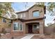 Two-story house with a front porch and walkway at 9331 S 33Rd Gln, Laveen, AZ 85339