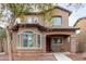 Two-story house with a front porch and walkway at 9331 S 33Rd Gln, Laveen, AZ 85339