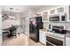 Modern kitchen with stainless steel appliances and white cabinets at 9331 S 33Rd Gln, Laveen, AZ 85339