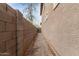 Side yard access with gravel and block wall at 9331 S 33Rd Gln, Laveen, AZ 85339