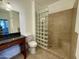 Bathroom featuring a vanity, a glass block wall, a toilet, and a tiled shower with a built-in bench at 10136 E Southern Ave # 1110, Mesa, AZ 85209