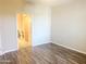 Bedroom with wood-look floors and access to bathroom at 10136 E Southern Ave # 1110, Mesa, AZ 85209